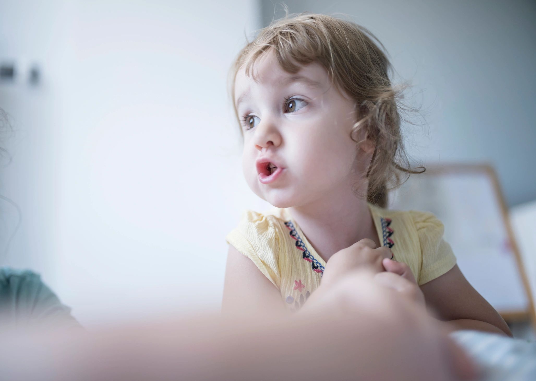 Child playing with toys during a learning activity