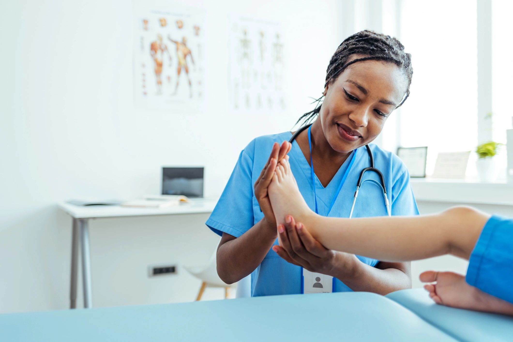 Physical therapist helping a child with a stretching exercise
