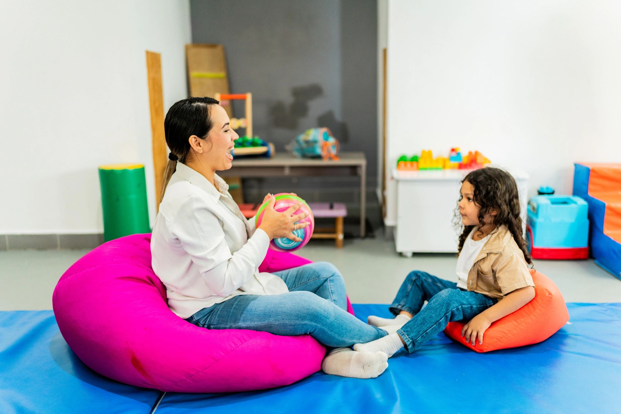 Therapist and child playing during a therapy activity