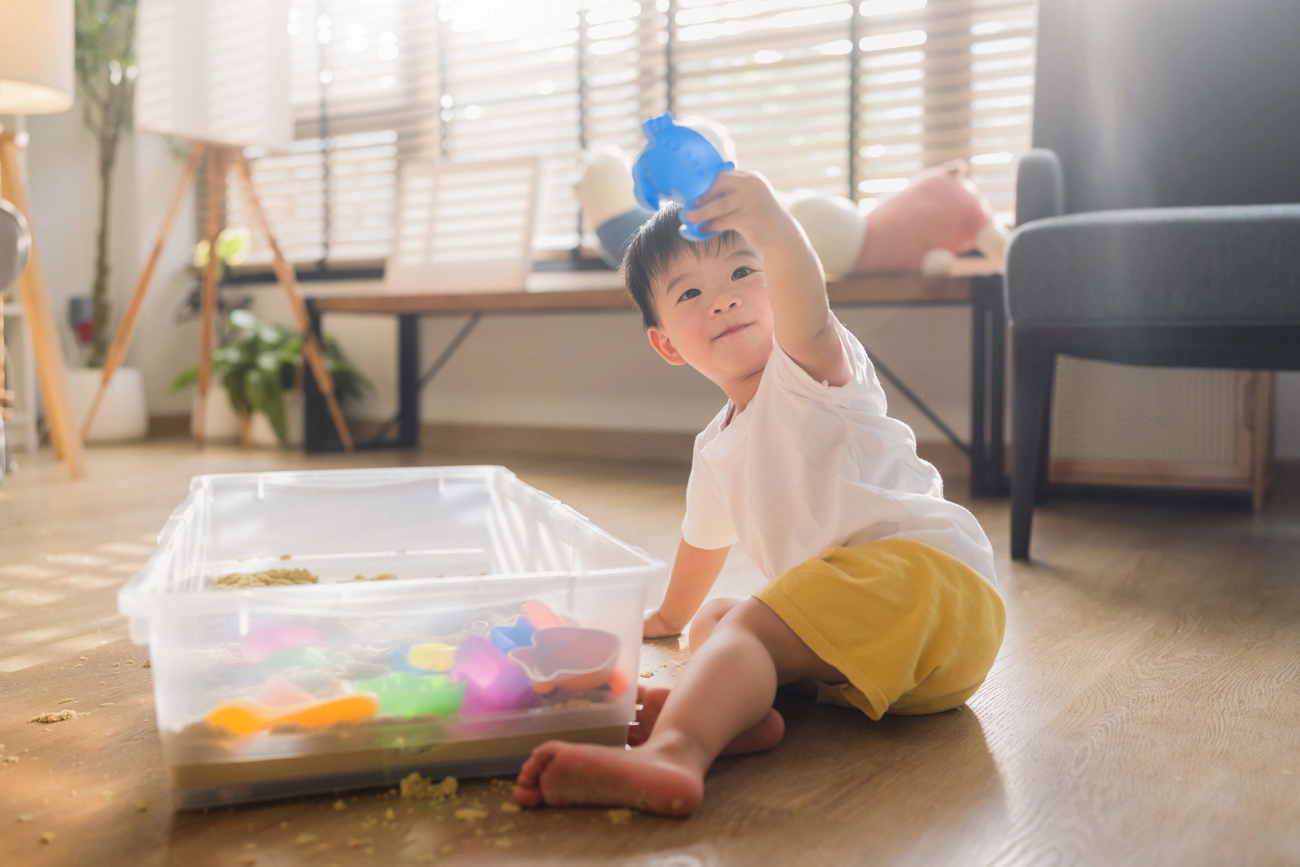Child doing sensory play activity that supports fine motor development
