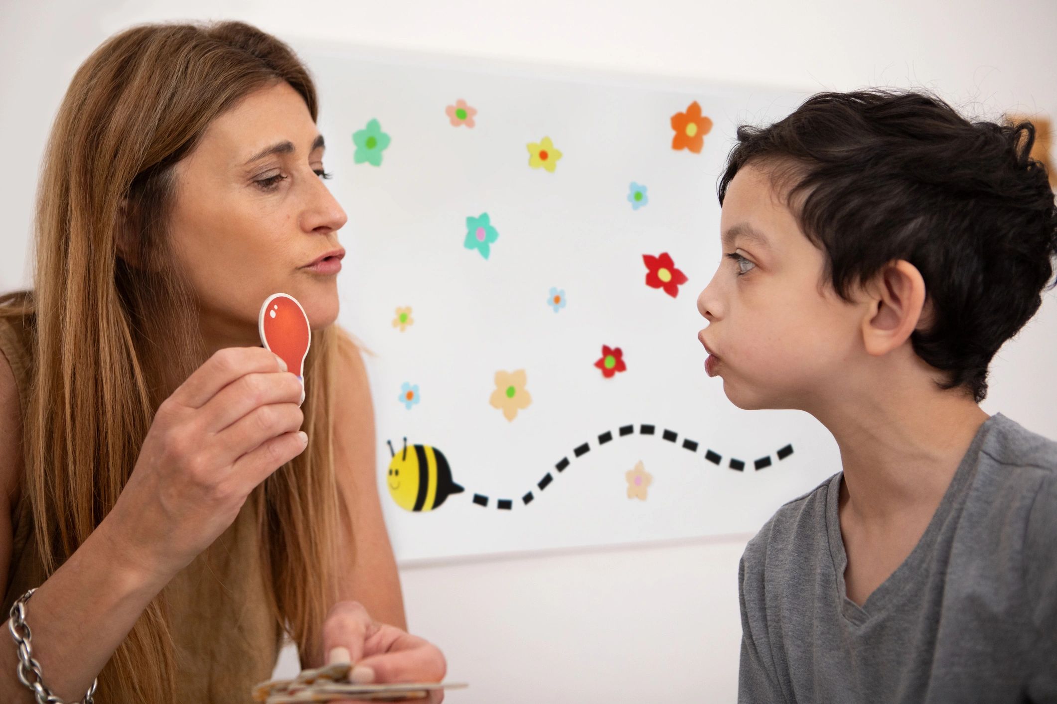 Speech therapist working with a child during a session