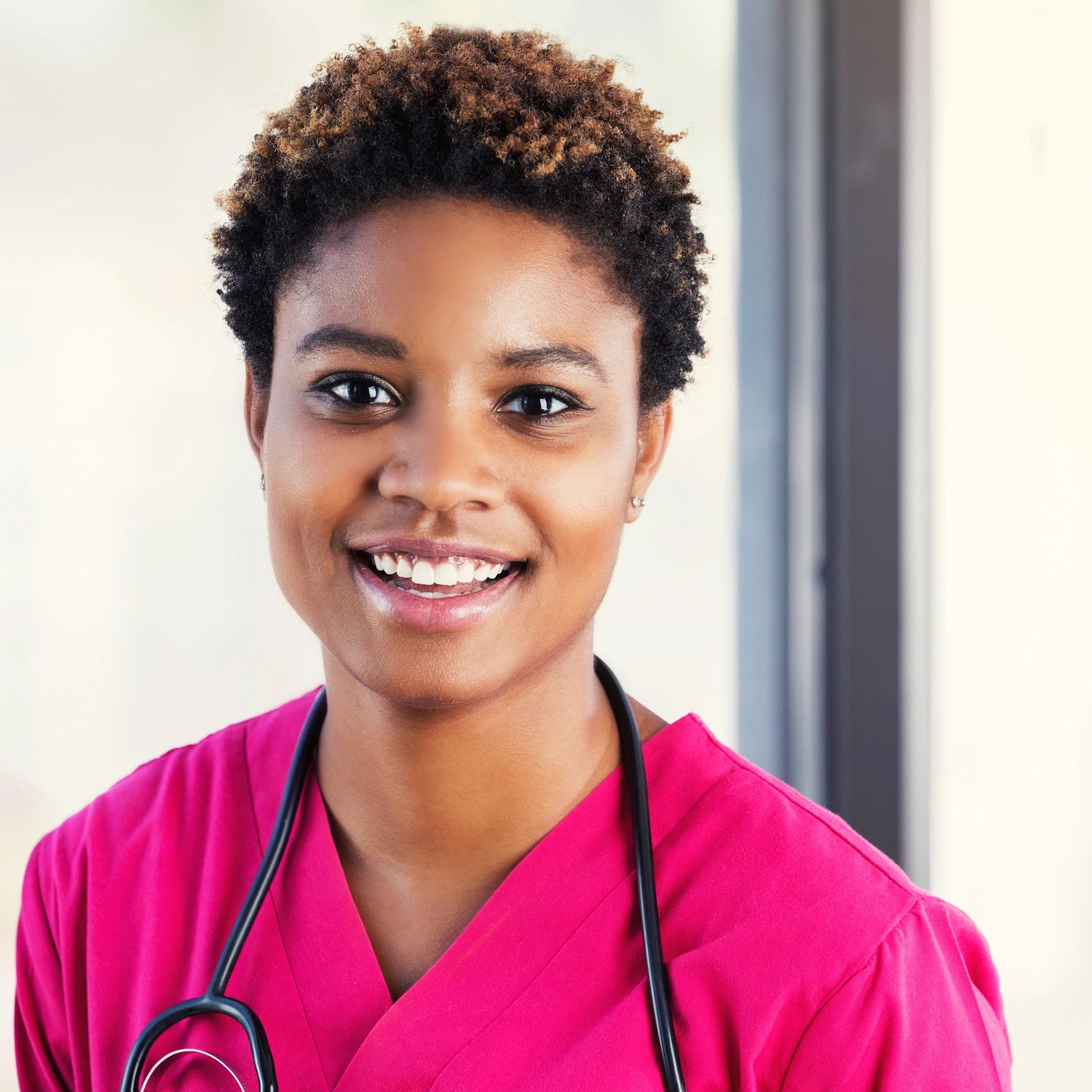 Smiling pediatric clinician portrait